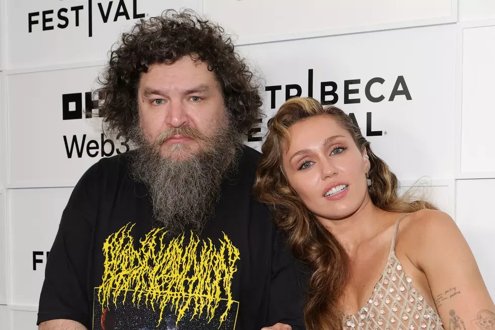 Man in Death Metal Shirt Takes Red Carpet Photo With Miley Cyrus – Who Is He?